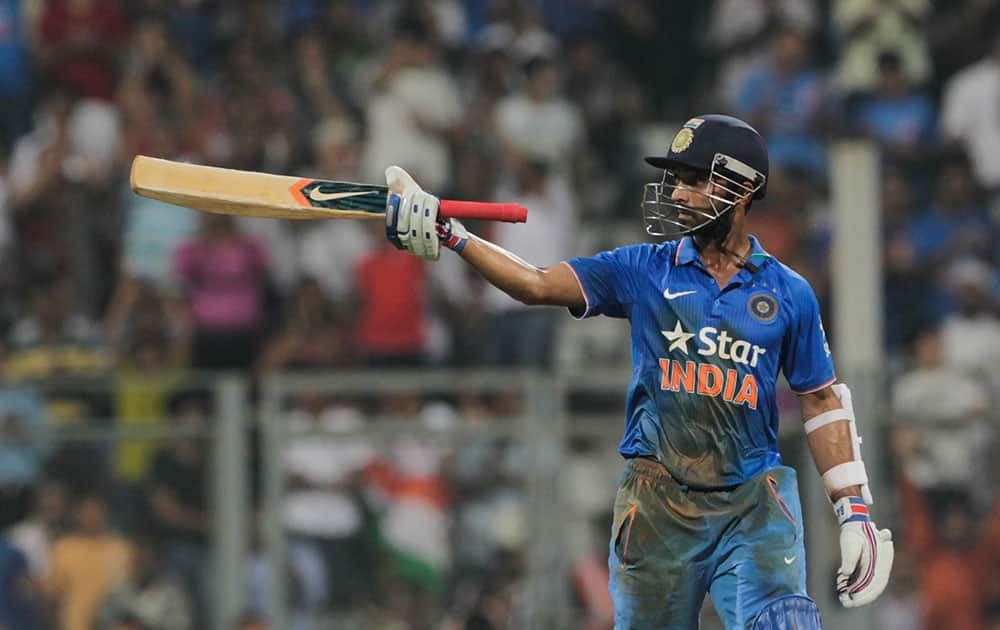 India's Ajinkya Rahane celebrates his fifty runs during the final one-day international cricket match of a five-game series against South Africa in Mumbai, India.