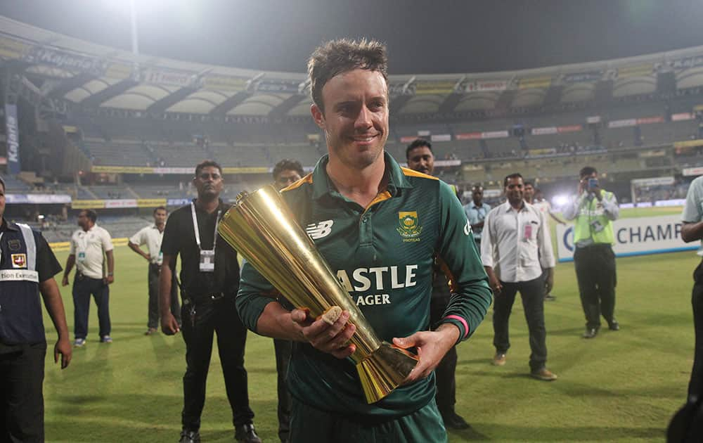 South African captain A.B. de Villiers, holds the series trophy after their victory against India in the final one-day international cricket match of a five-game series in Mumbai, India.