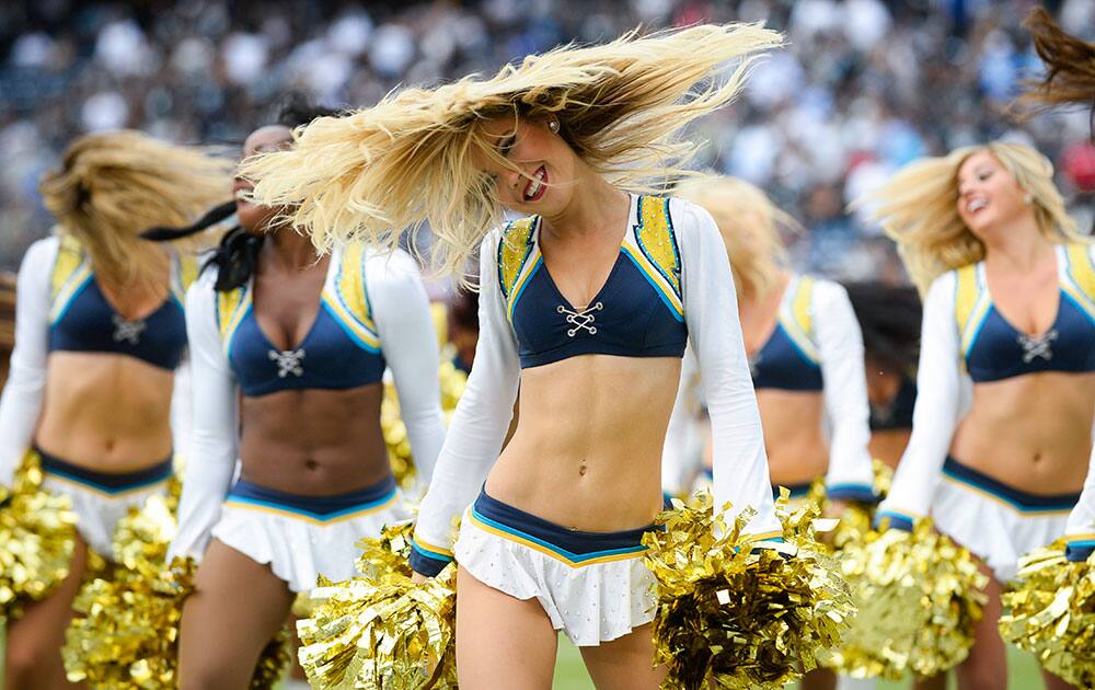 San Diego Chargers cheerleaders perform during the second half of an NFL football game against the Oakland Raiders in San Diego.