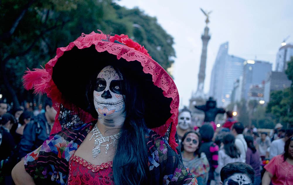 A woman dressed up and with her face painted as a 