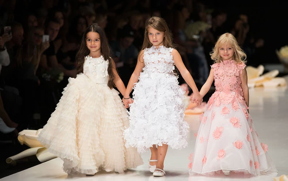 Child models display creations by Russian designer Yulia Prokhorova during Fashion Week in Moscow, Russia.