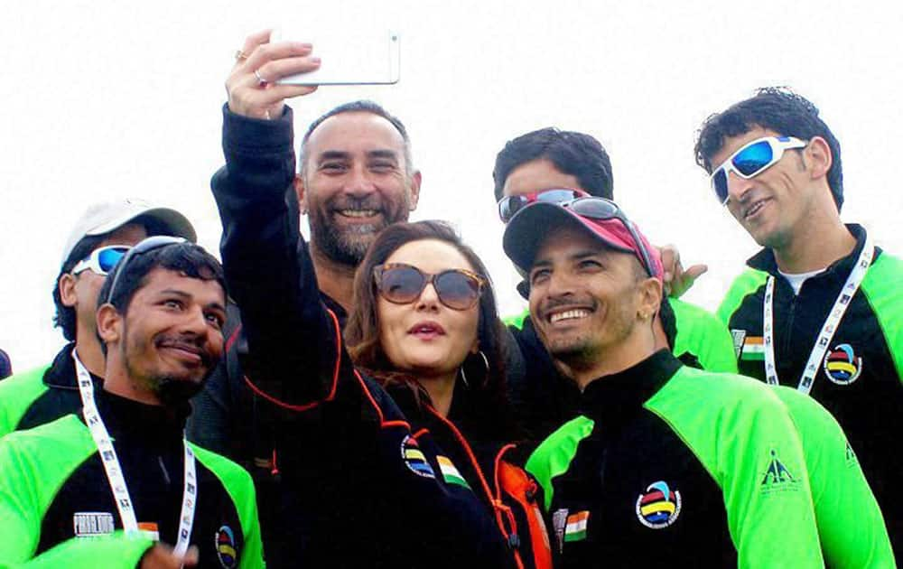 Actress Priety Zinta clicks selfie with the Indian team at the ongoing Paragliding World Cup at Bir Billing, Himachal Pradesh.