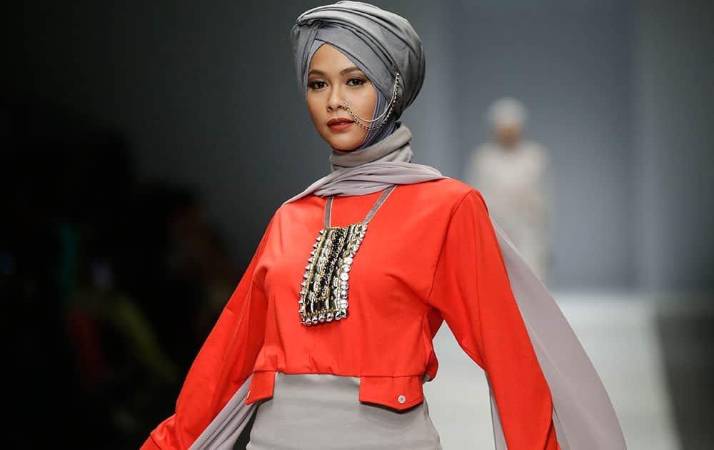 A model displays a creation by Najua Yanti during the Jakarta Fashion Week 2016 in Jakarta, Indonesia.