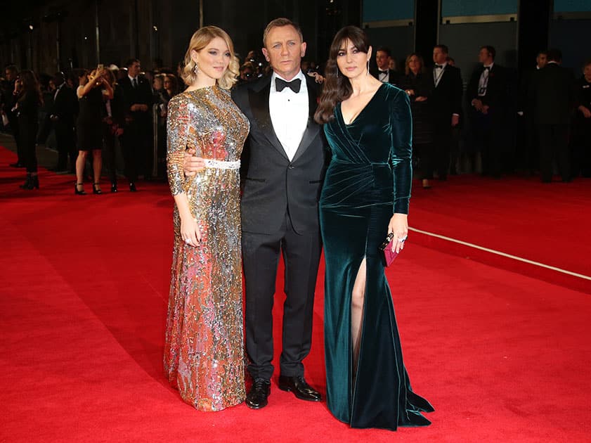 Lea Seydoux, from left, Daniel Craig and Monica Bellucci pose for photographers upon arrival for the World Premiere of 'Spectre' at the Royal Albert Hall in central London.