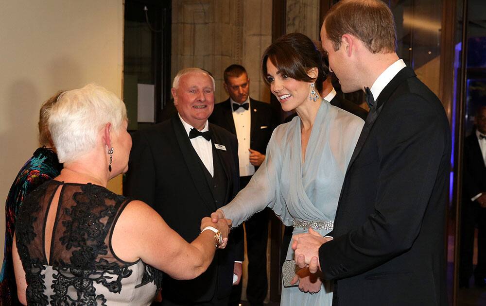 Britain's Prince William and Kate the Duchess of Cambridge meet charity representatives as they attend the World Premiere of the new James Bond film Spectre, in London.