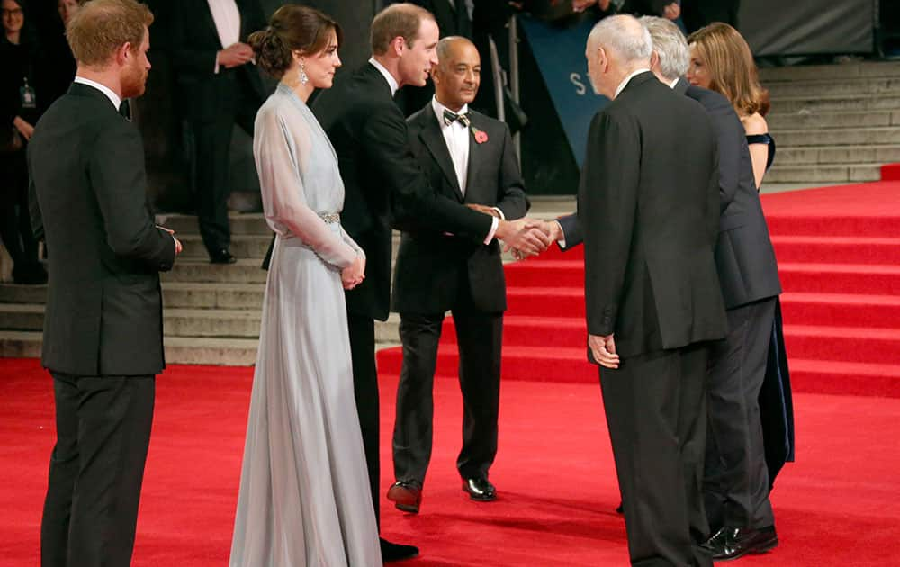 Prince Harry and the Duchess and Duke of Cambridge meet with, from right, producer Barbara Broccoli, director Sam Mendes and Michael G. Wilson at the World Premiere of 'Spectre' at the Royal Albert Hall in central London.