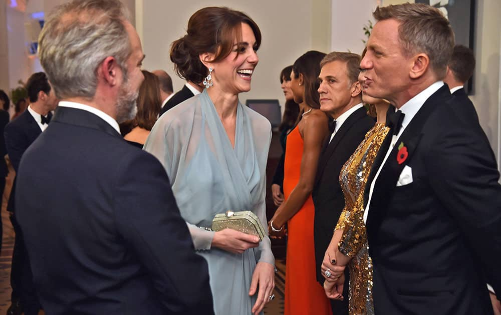 Kate, the Duchess of Cambridge, meets actor Daniel Craig with director Sam Mendes at left, during the World Premiere of the new James Bond film Spectre, in London.