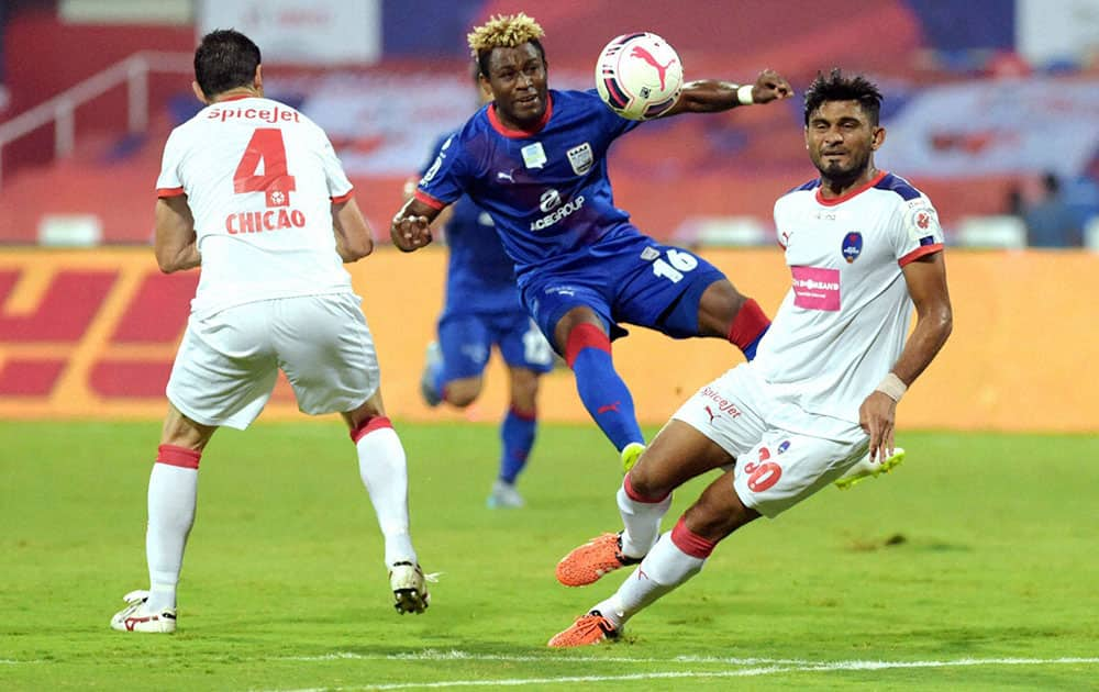 Mumbai City FC (Blue) and Delhi Dynamos FC (White) players in action during the Indian Super League (ISL) match at DY Patil Stadium in Navi Mumbai.