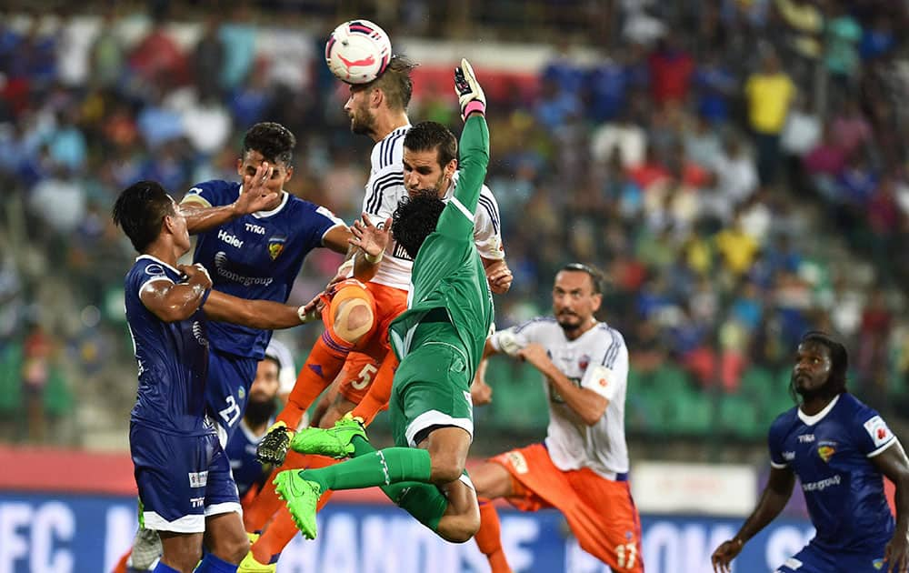 Chennaiyan FC and FC Pune City players vie for the ball during the Indian Super League (ISL) match at Jawaharlal Nehru Stadium in Chennai.