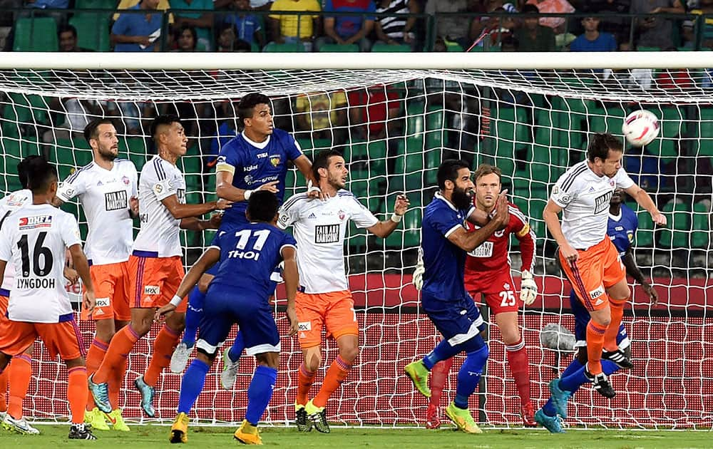 Chennaiyan FC and FC Pune City players vie for the ball during the Indian Super League (ISL) match at Jawaharlal Nehru Stadium in Chennai.