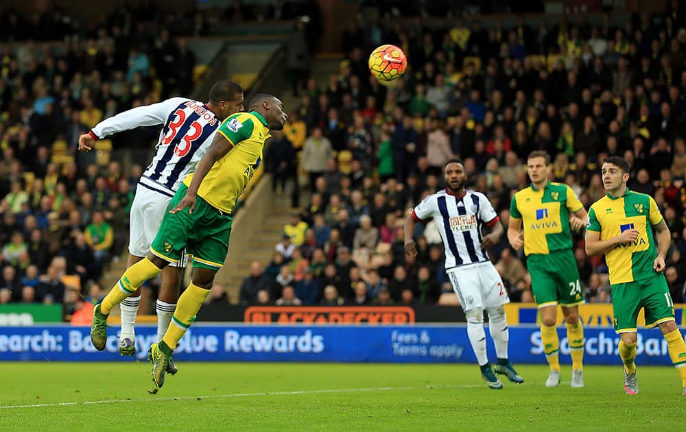 West Bromwich Albion's Salomon Rondon, left heads the ball to score, during the EnglishLeague soccer match between Norwich City and West Bromwich Albion, at Carrow Road, in Norwich, England.