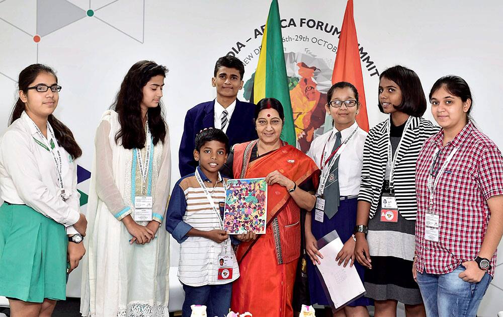 External Affairs Minister Sushma Swaraj meets children who won a painting contest organised as a part of the activities of the India Africa Forum Summit in New Delhi.