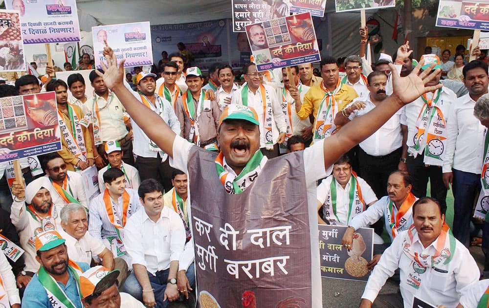 NCP party supporters stage protest against government for rising prices of essential commodities in Nagpur, Maharashtra.