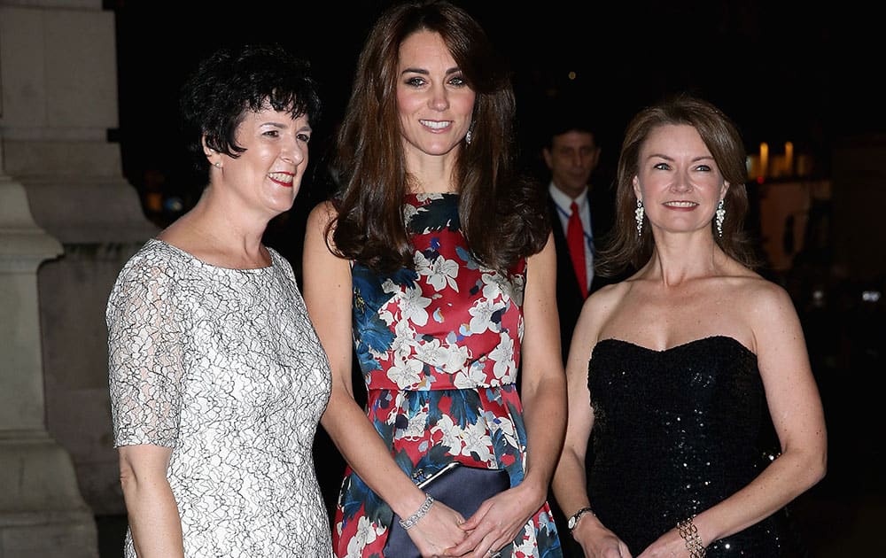 Kate, Duchess of Cambridge poses with CEO of 100 Women in Hedge funds Amanda Pullinger, left, and chairwoman Mimi Drake at the 100 Women In Hedge Funds Gala Dinner at the Victoria and Albert Museum in London.