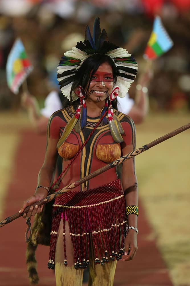 a Brazilian woman from the Pataxo ethnic group takes part in the parade of indigenous beauty at the World Indigenous Games, in Palmas, Brazil.