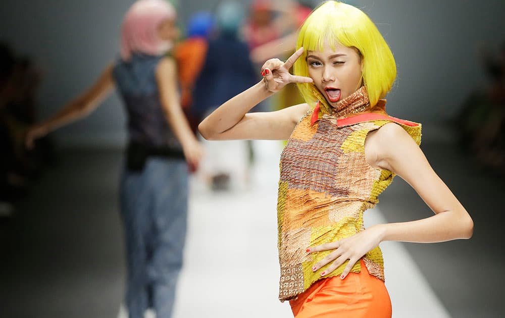 A model displays a creation by Obin during Jakarta Fashion Week.