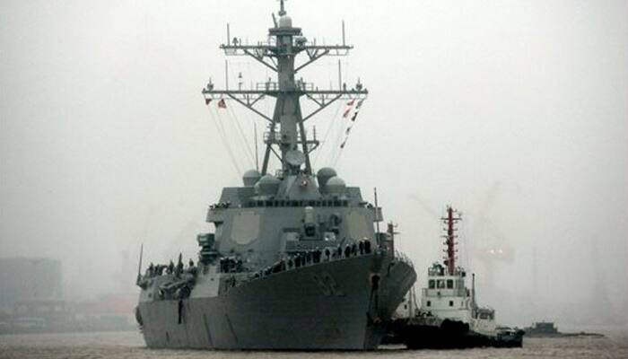 China summons US envoy over warship sailing in South China Sea reef