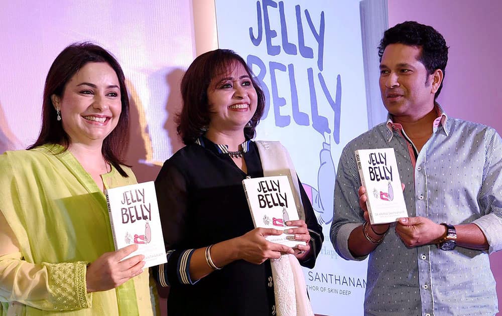 Cricket legend Sachin Tendulkar with his wife Anjali during the launch of a book Jelly Belly wrriten by Aparna Santhanam (C) in Mumbai.