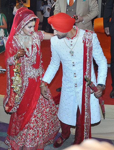 Cricketer Harbajan Singh and Geeta Basra during their marriage ceremony, in Jalandhar.