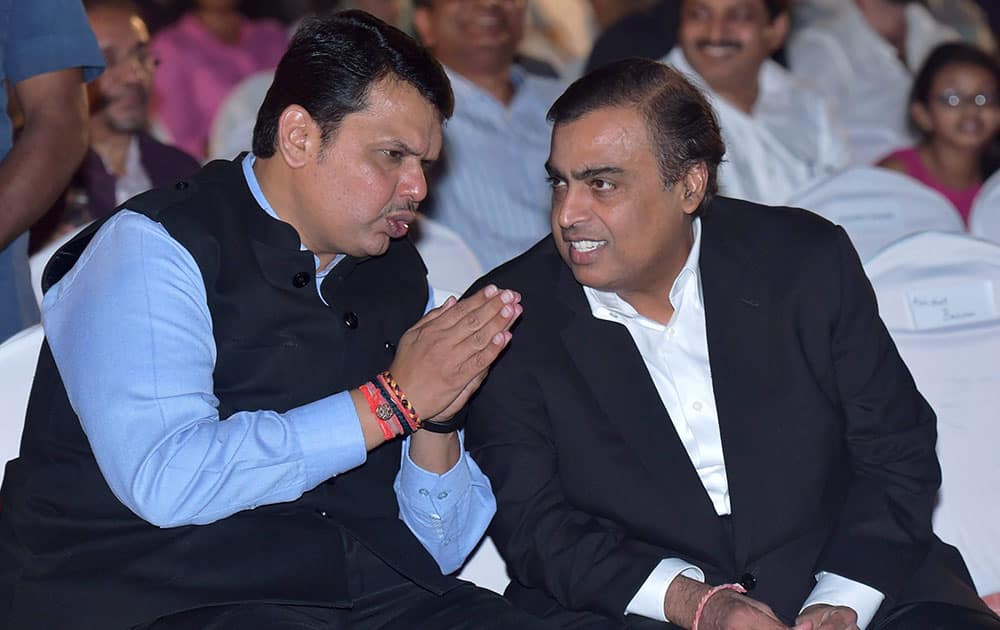 Maharashtra Chief Minister Devendra Fadnavis interacts with industrialist Mukesh Ambani during the opening ceremony of 17th edition of Jio MAMI Mumbai Film Festival, in Mumbai.