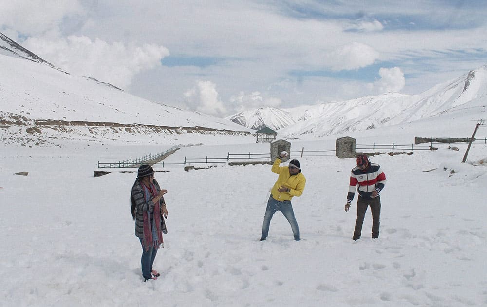 Tourists thrown snowballs to each other following the season’s 2nd snowfall on Mughal Road near Peer Ki Gali in South Kashmir’s Shopian district.