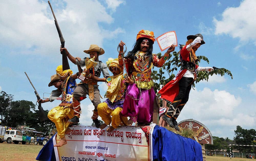 Children cheering after recieving prize for their tableau at the 60th Kannada Rajyotsava Celebrations in Chikmagalur.