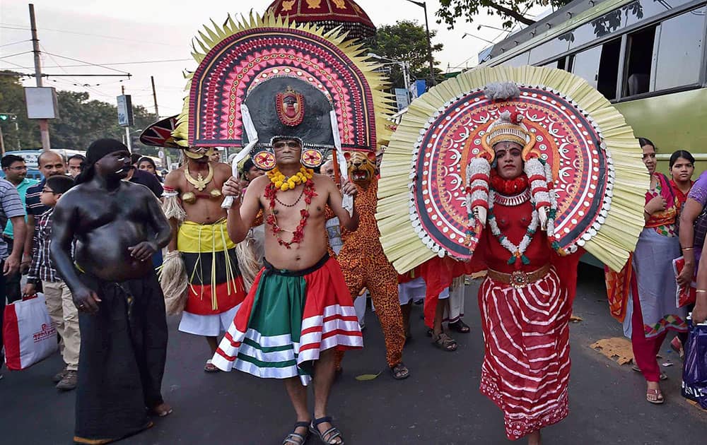 People from Kerala take part in a procession to celebrate 60th Kerala Day in Kolkata.