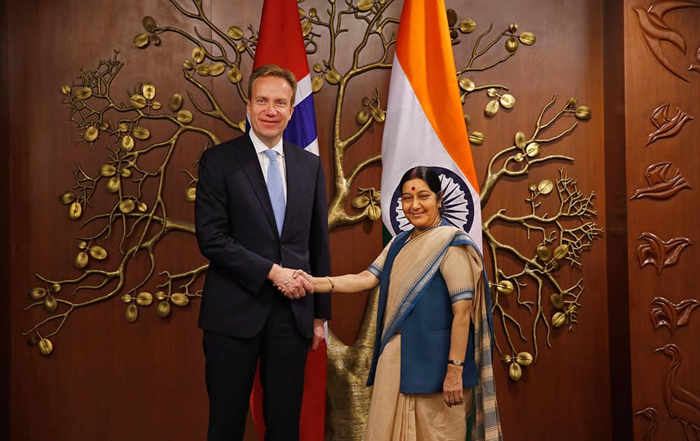 Norwegian Foreign Minister Borge Brende poses with his Indian counterpart Sushma Swaraj, during their meeting in New Delhi.