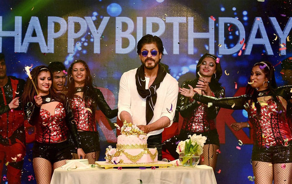 Shahrukh Khan cuts a cake during his birthday celebrations at a hotel in Mumbai.