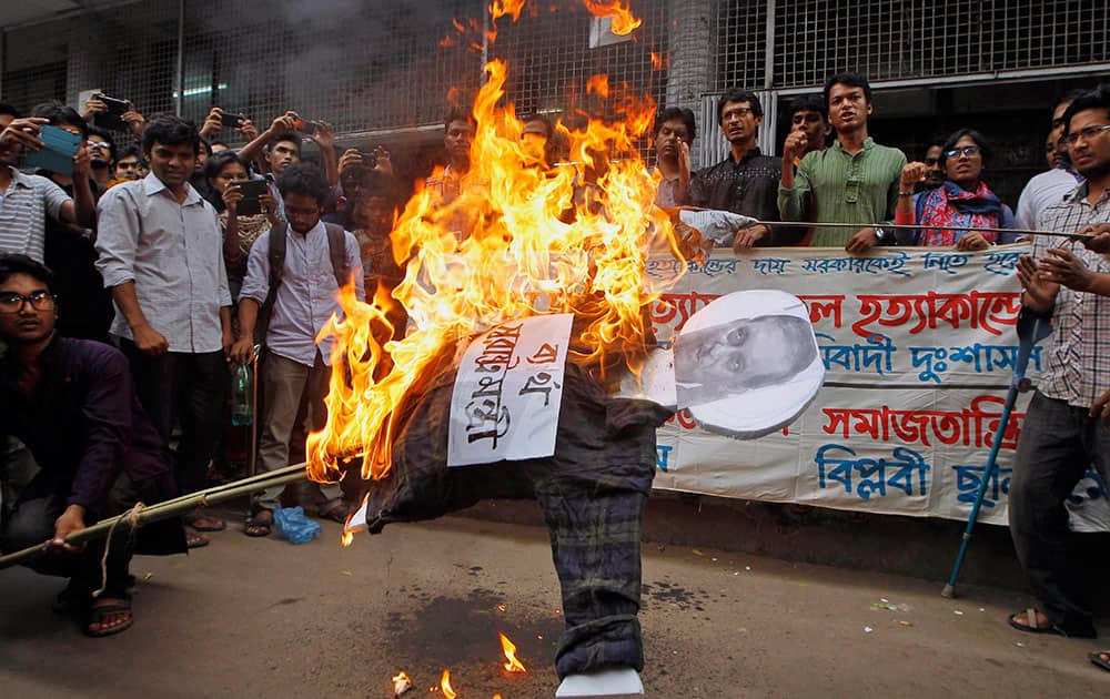 Students and activists set fire on an effigy during the half-day nationwide strike in Dhaka, Bangladesh.