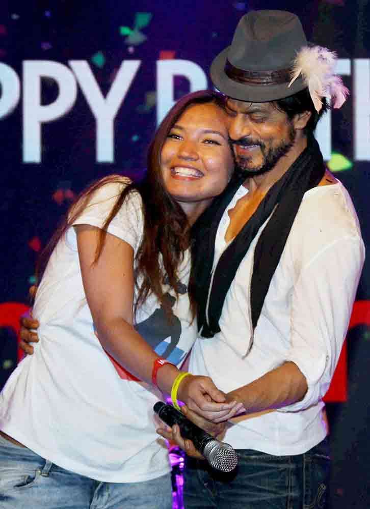 Actor Shah Rukh Khan with a Chinese fan during his 50th birthday celebrations in Mumbai.