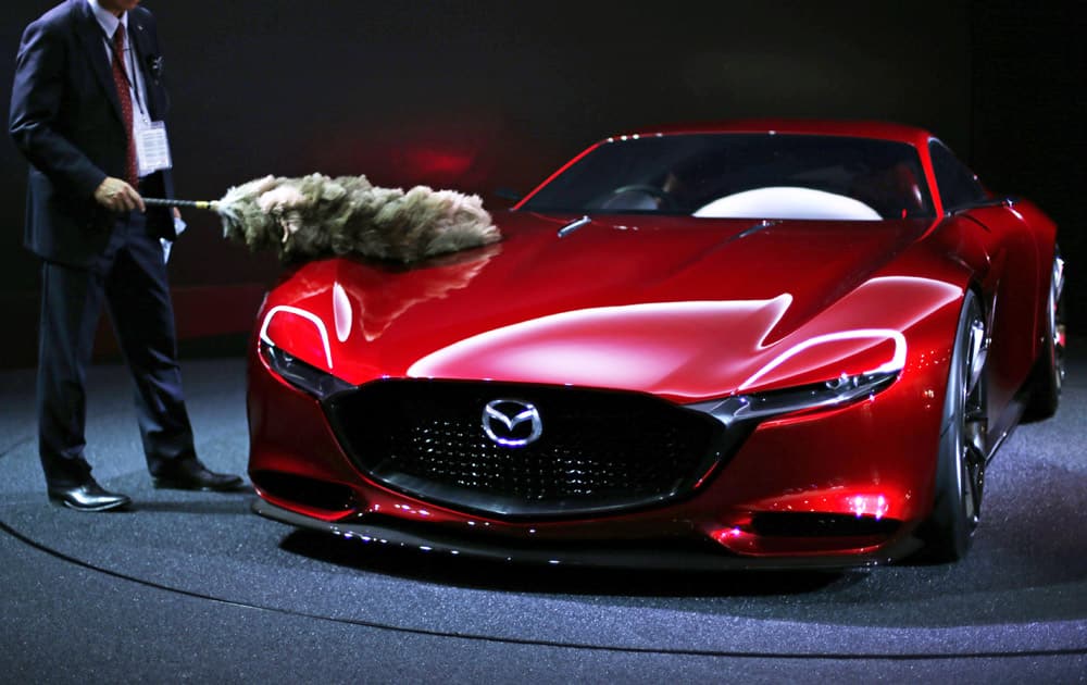 The Mazda RX-Vision concept vehicle is dusted during the media preview of the Tokyo Motor Show in Tokyo Thursday, Oct. 29, 2015.

 