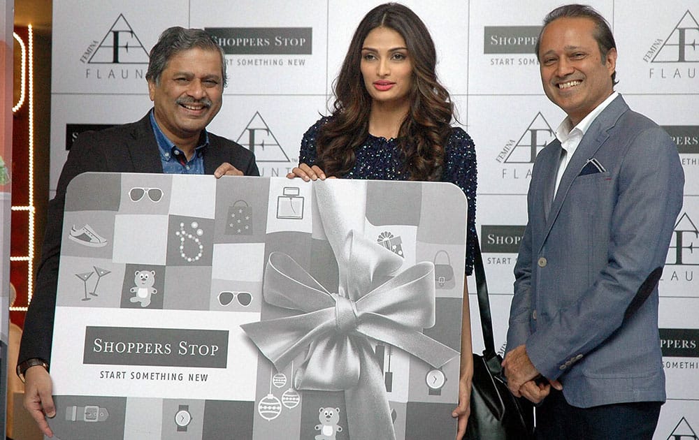 Actress Athiya Shetty with Vineet Jain, MD of BCCL and Govind Shrikhande, MD of Shoppers Stop Ltd (L) during the launch of Femina FLAUNT winter fashion collection in Mumbai.