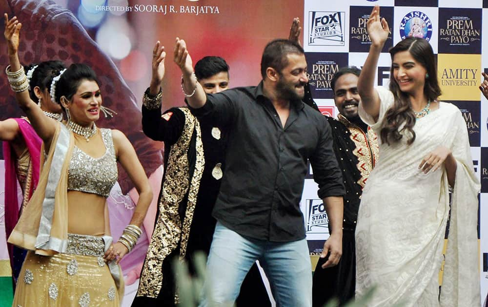 Actor Salman Khan and actress Sonam Kapoor dance during the promotional event of their film Prem Ratan Dhan Payo in Noida.