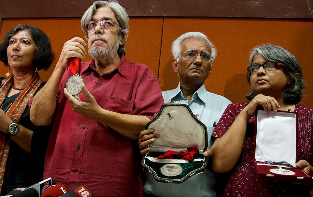 From left, Madhushree Dutta, Saeed Mirza, Kundan Shah and Irene Malik Dhar who are among Indian film industry figures returning National Film Awards pose before the media in Mumbai.