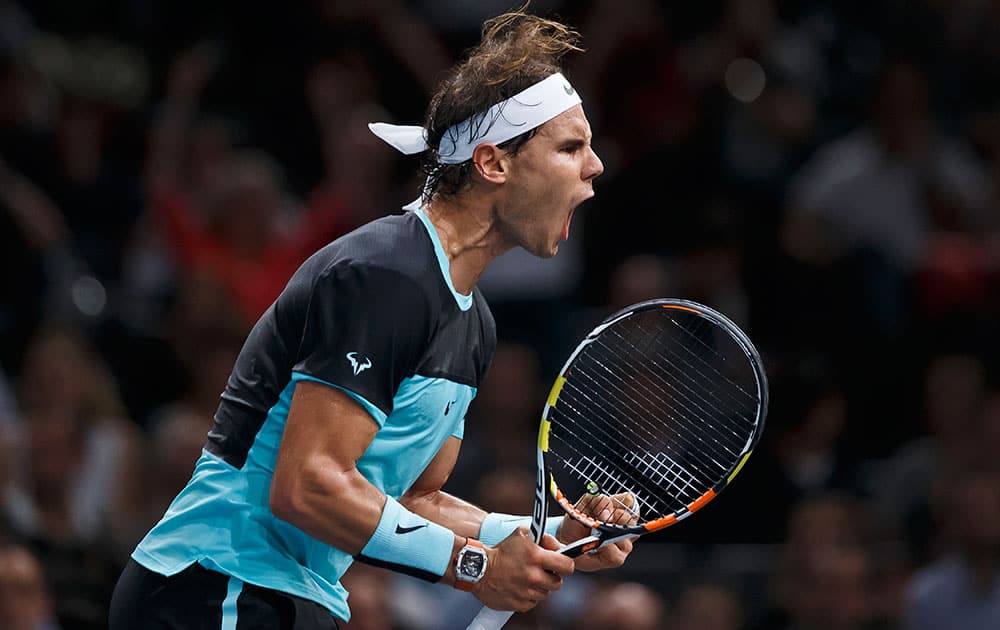 Rafael Nadal of Spain celebrates as he is wins a point against Kevin Anderson of South Africa during their third round match of the BNP Masters tennis tournament at the Paris Bercy Arena, in Paris, France.