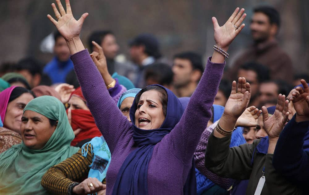 Kashmiri women shouting slogans as they listen to Prime Minister Narendra Modis speech at a rally at Sher-e-Kashmir Cricket Stadium in Srinagar.