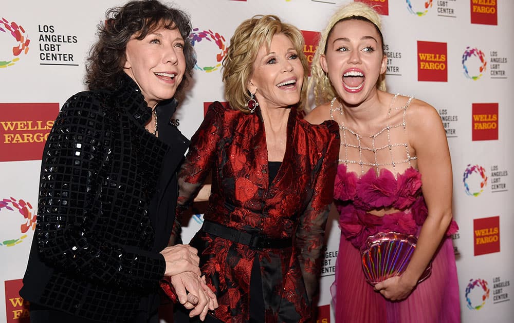 Presenter Lily Tomlin, left, poses with honorees Jane Fonda, center, and Miley Cyrus at the Los Angeles LGBT Center's 46th Anniversary Gala Vanguard Awards at the Hyatt Regency Century Plaza in Los Angeles. 