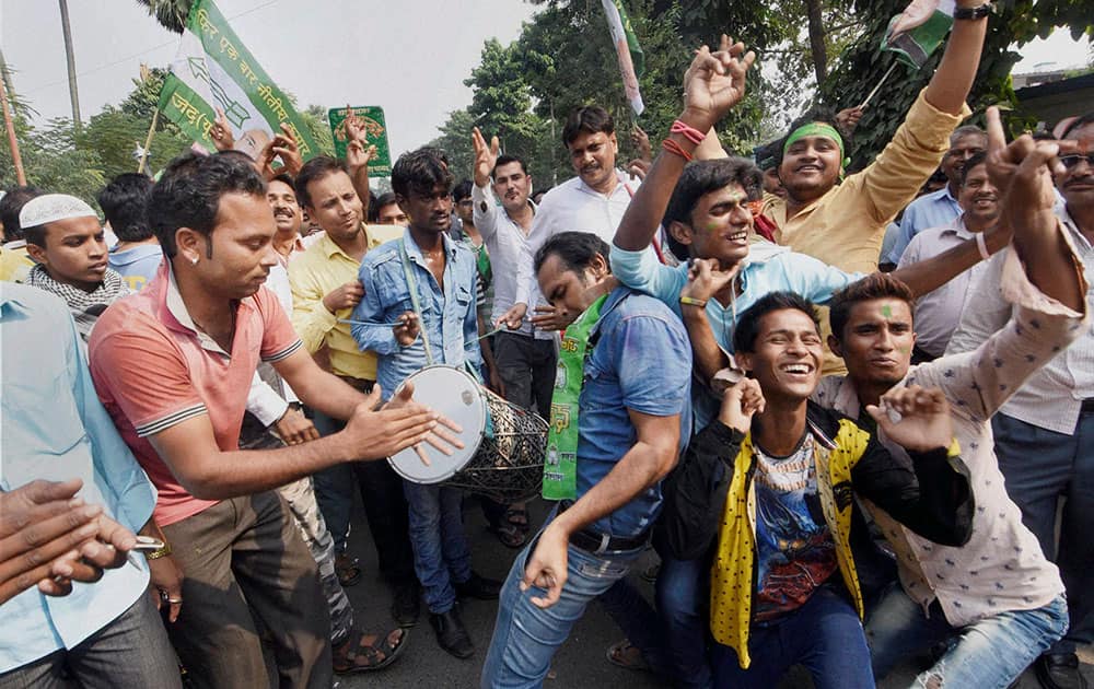 Supporters dance as they celebrate the Mahagathbandhans (Grand Alliance) victory in Bihar assembly elections in Patna.