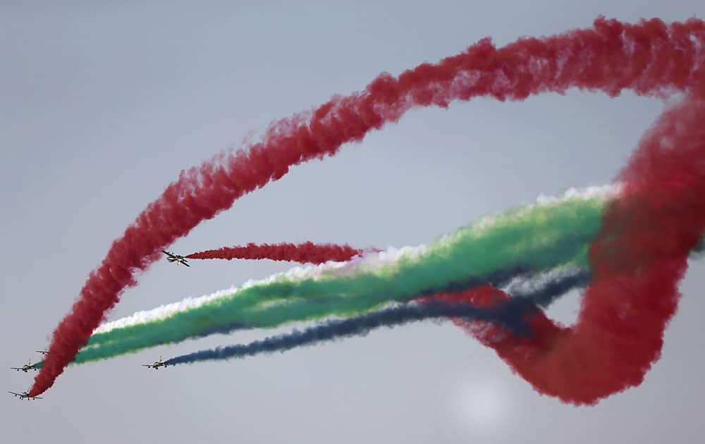 Al Fursan, the UAE Air Force aerobatic display team, perform during the opening of the Dubai Airshow in United Arab Emirates.