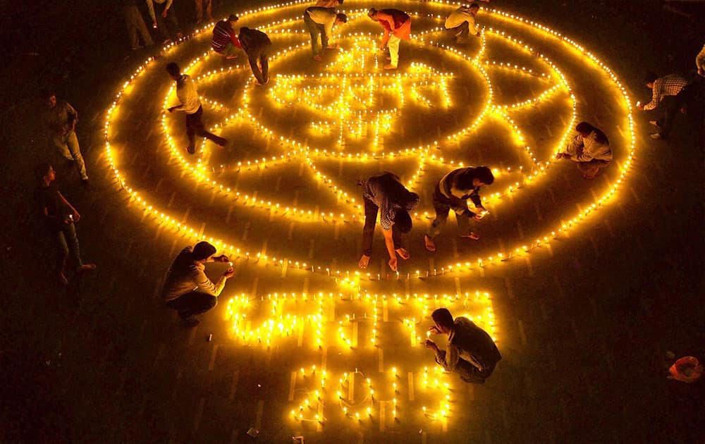 People light earthen Lamps in an artistic style on the occasion of Dhanteras ahead of Diwali festival in Moradabad.