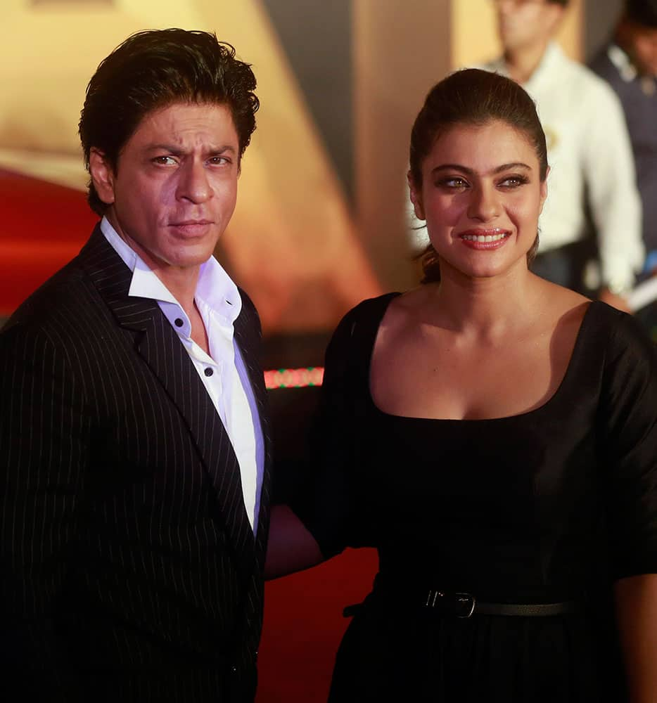 Shah Rukh Khan and Kajol pose for photos before the trailer launch of 