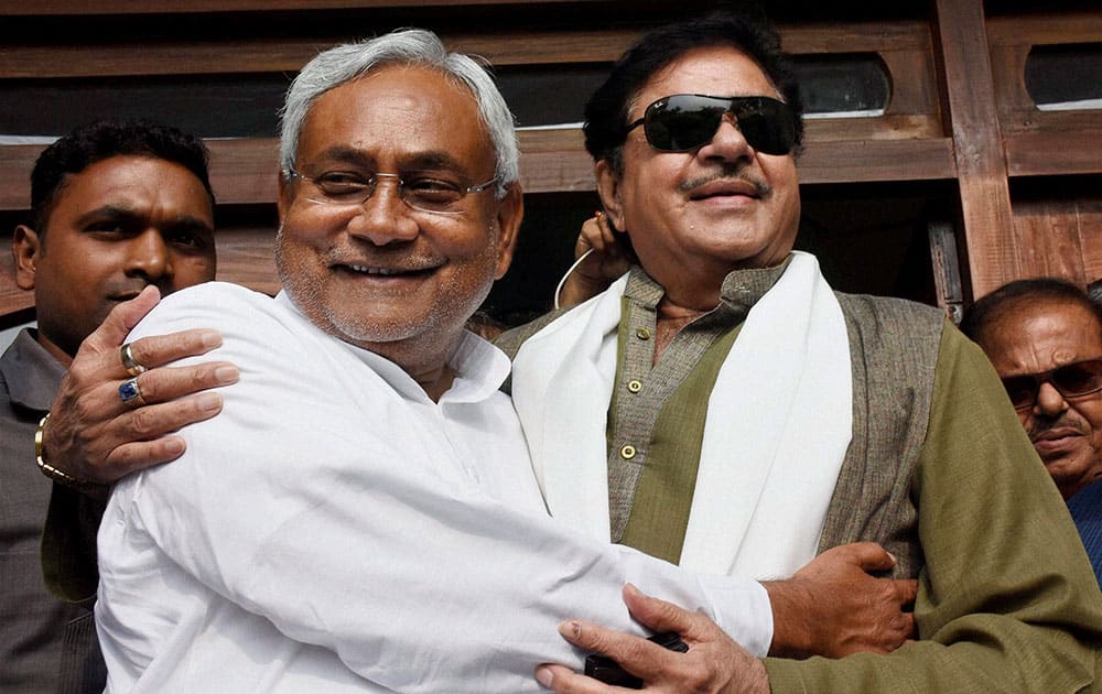 Actor and BJP MP Shatrughan Sinha hugging Bihar Chief Minister Nitish Kumar after his success in the Bihar elections, in Patna.