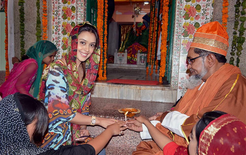 Hrishita Bhatt lighting a lamp on the eve of Diwali at a tomb in Agra.