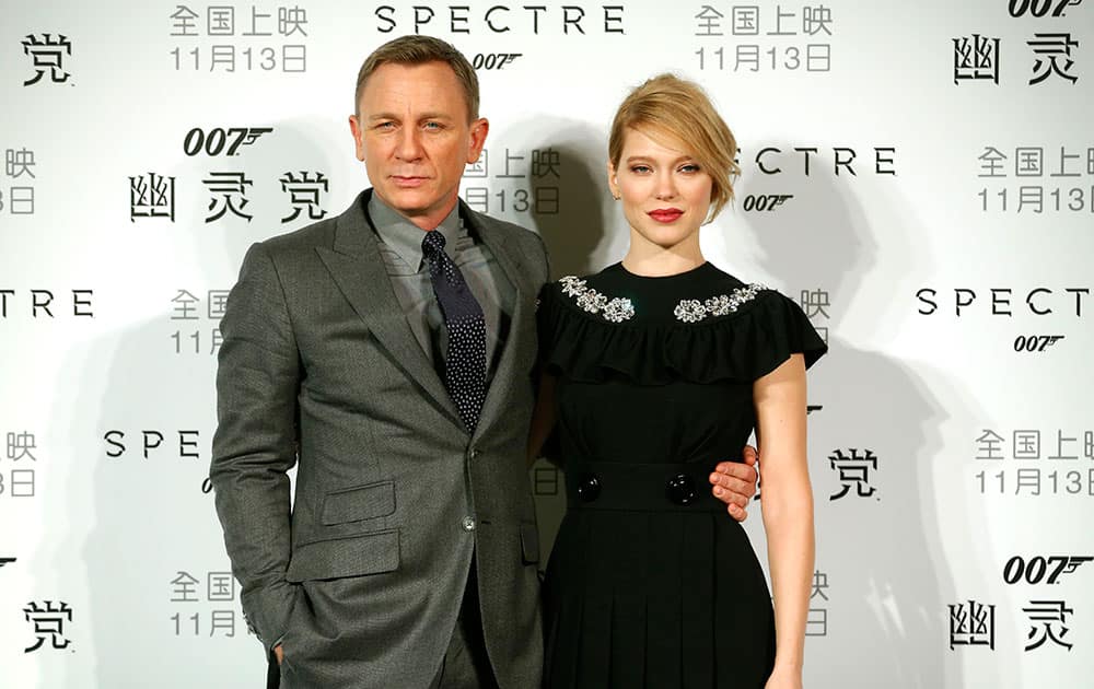 British actor Daniel Craig and French actress Lea Seydoux pose for photographers before a press conference for the movie 'Spectre' in Beijing.