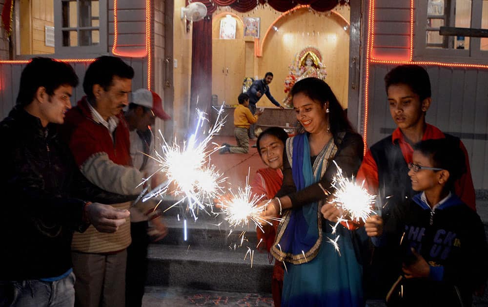 Kashmiri pandits celebrating Diwali Festival by burning crackers,at Lal Chowk in Srinagar.