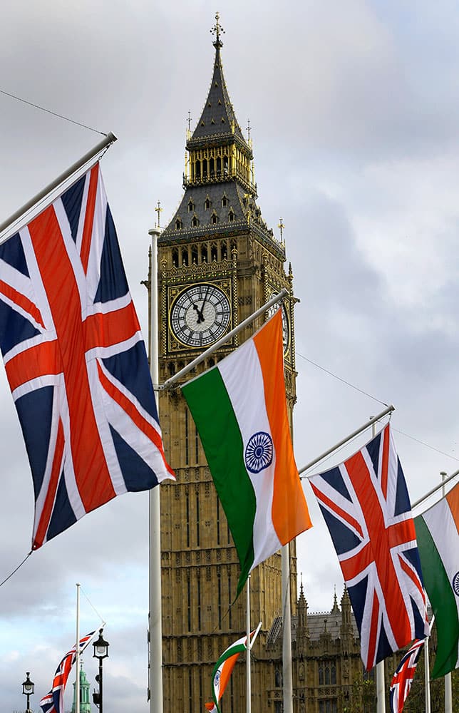 The Union and Indian flags hang near the London landmark Big Ben in Parliament Square in London.