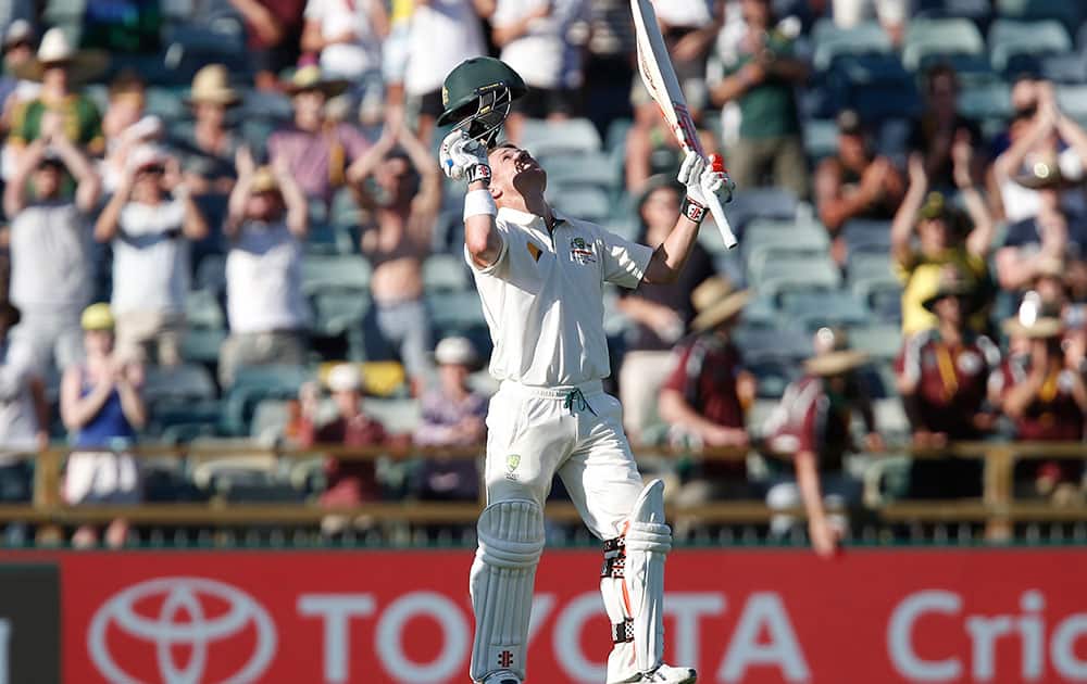 Australia's Dave Warner looks to the sky after scoring a double century against New Zealand during their cricket test match in Perth, Australia.