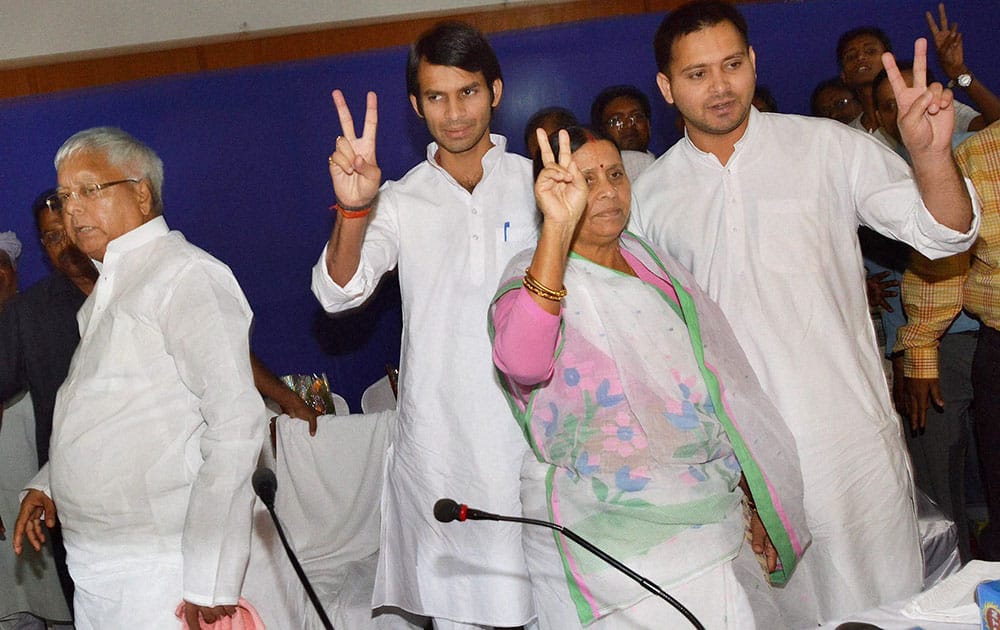 RJD Chief Lalu Prasad along with wife and former Bihar CM Rabri Devi and their newly elected MLA sons Tejashwi and Tej Pratap at a press conference in Patna.