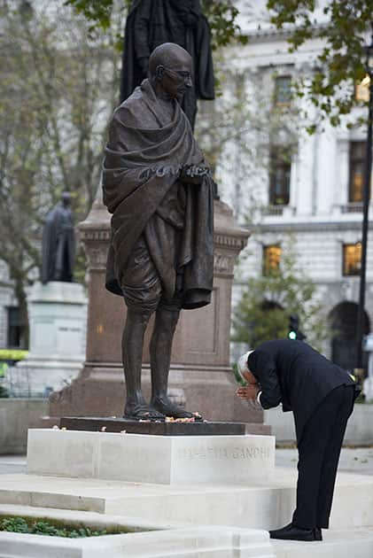 Prime Minister Narendra Modi pays homage at the statue of Mahatma Gandhi, in Parliament Square, London.